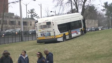 Six people injured in crash that sent MBTA bus through fence, into cemetery in Jamaica Plain